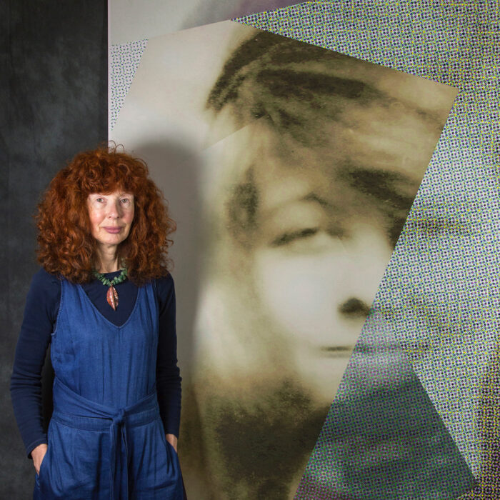 Shows photographer Julia Cameron with her work